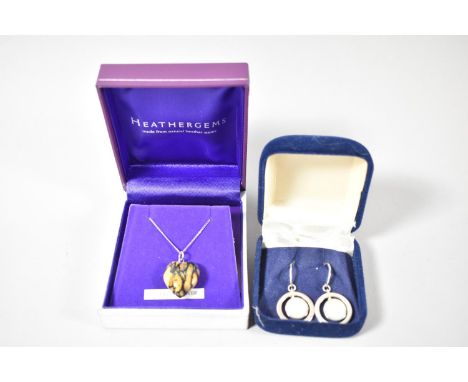 A Pair of Silver and Mother Pearl Earrings and a Silver Chain with Pressed Leather Pendant 