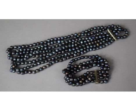 A Four Strand Black Tahitian Style Pearl Necklace and Bracelet Set 