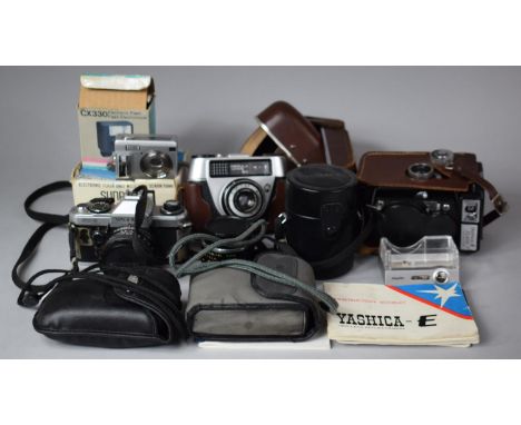 A Collection of Vintage Cameras and Lenses to Include Yashica-E in Leather Case, Yashica Telephoto Lens and FX-D 33mm Camera,