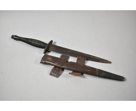 A WWII Commando Dagger with Leather Scabbard, Blade Tip Missing 