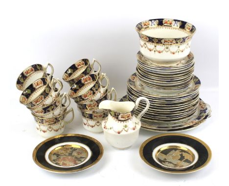 A 20th century Mona twelve-piece part tea service. Decorated with floral and gilt decoration with a blue rim, including cups 