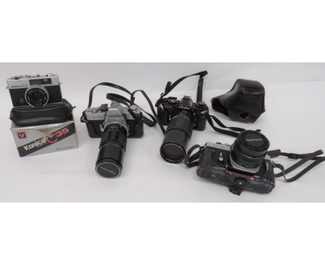 Three Minolta Camerasconsisting Model SRT101 with Hoya 52mm Skylight lens ... Model XE-5 with 50 mm lens ... Model XD-7 with 