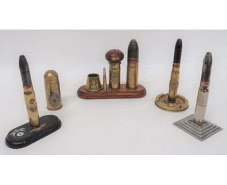 Five Various Trench Art Shells Including Lightersconsisting 20 mm case with removable shell showing lighter.  Front with RAF 