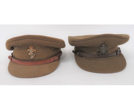 Two Officer Service Dress Capsconsisting khaki crown, body and stiffened peak.  Leather chinstrap secured by darkened General