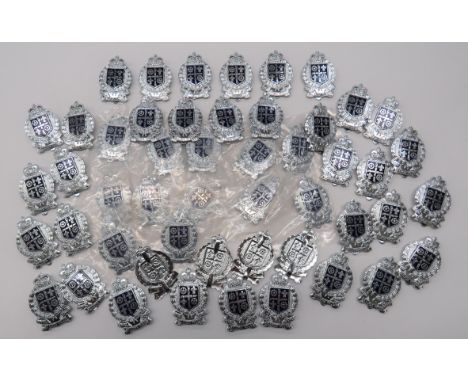 50 x Royal St Lucia Police Force Cap Badgeschrome and enamel, QC cap badges.  41 x slider fixing.  9 x folded blades.  Clean 