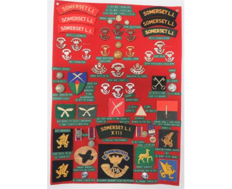43 Items Of Insignia For Somerset Light Infantrydisplay board with good tabulated display of metal and cloth badges including