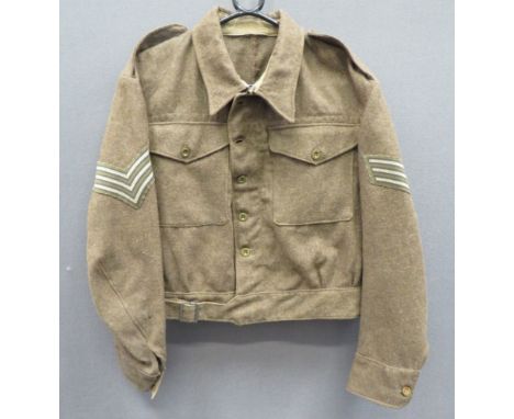 1940 Pattern Battledress Jacketkhaki woollen, single breasted, closed collar, short jacket.  Lower extended belt.  Patch pock