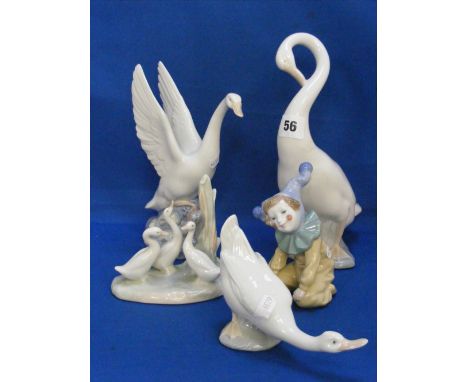 Five Nao figures, four in the form of geese and one of a young boy dressed as a clown.