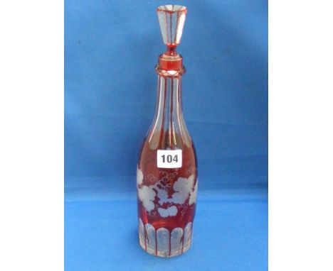 An attractive Bohemian wine decanter in red, clear and frosted glass and etched with fruits on the vine decoration.