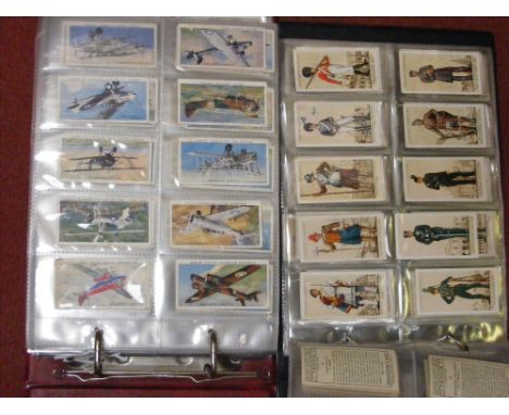 Two albums of John Player & Sons cigarette cards, to include Aircraft of the R.A.F., Association Cup Winners, birds and their