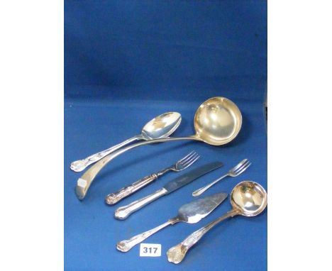 A collection of good quality cutlery items, to include Mappin & Webb knives and forks, a nice silver-plated soup ladle and ot