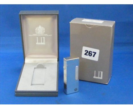 A Dunhill silver-plated cigarette lighter in original box.