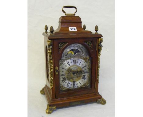 A fine quality walnut cased chiming bracket clock with a Schatz movement and secondary dial, having metal mounts, handle and 