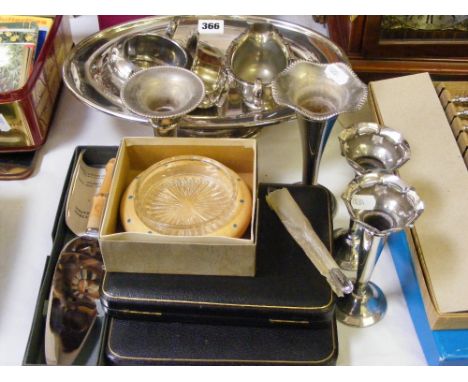 A collection of silver-plated dinnerware, candlesticks, boxed flatware and two boxed sets of Ashberry cutlery.     