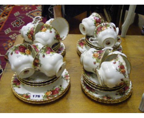 A set of twelve Royal Albert cups, saucers and plates in 'Old Country Roses' pattern.