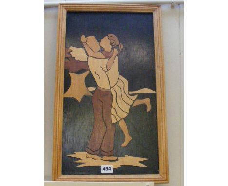 A framed Art Deco marquetry panel depicting a stylised embracing couple.   