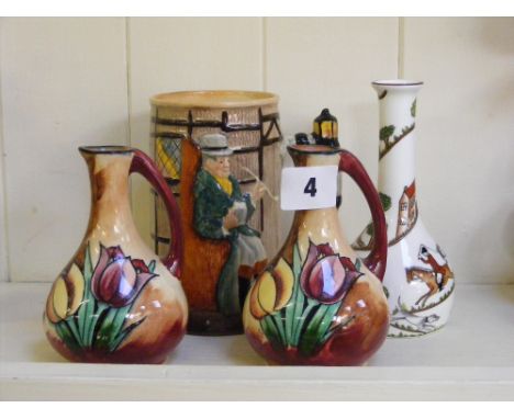 A Crown Staffordshire bud vase depicting hunting scenes, a pair of H&K Tunstall jugs and a tankard of Tony Weller and mine ho