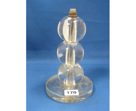 An Art Deco glass lamp base attributed to Jacques Adnet and Baccarat, c1930.  The thick circular glass base surmounted by thr