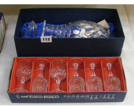 A boxed Royal Doulton crystal decanter and a boxed set of six French crystal sherry glasses.