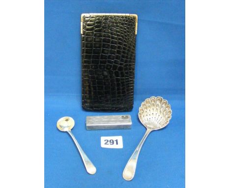 A silver caster spoon, Sheffield 1905, a silver mustard spoon, a leather glasses case and a lighter.