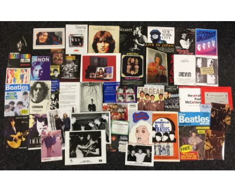 BEATLES PHOTOGRAPHS - a folder of Beatles and related ephemera to include promotional photos, adverts for albums, books and f