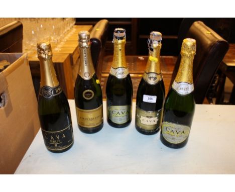 Five bottles of sparkling wine