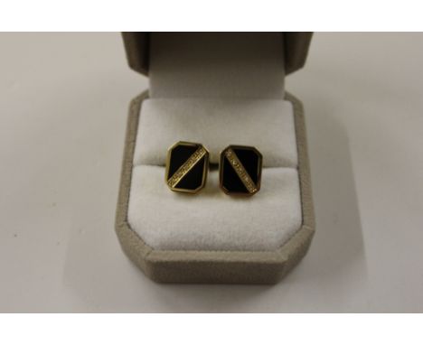 A pair of 14ct gold diamond set cufflinks