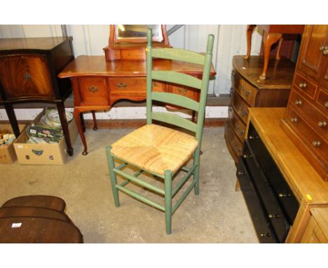 A set of four green painted ladder back and rush seated dining chairs