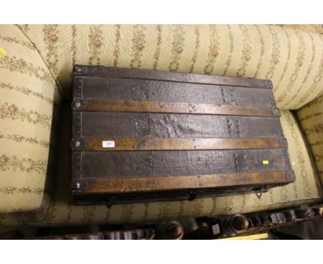 A wooden bound travelling trunk