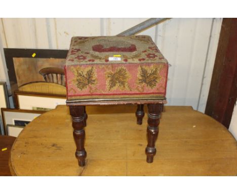A Victorian mahogany and tapestry upholstered stool depicting a cat