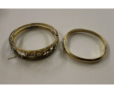 A yellow metal turquoise set bangle, AF and a yellow metal bangle