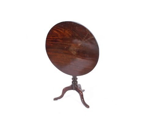 A Georgian mahogany circular snap top occasional table raised on tripod base