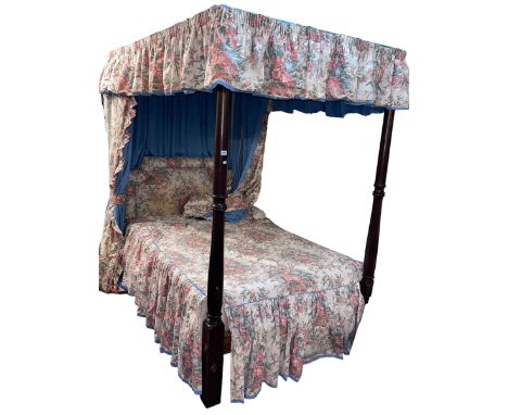 Turned mahogany 4ft four poster bed complete with floral print drapes.