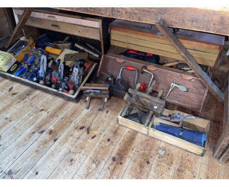 Two carpenters tool chests and a collection of carpentry tools including planes, chisels, etc.