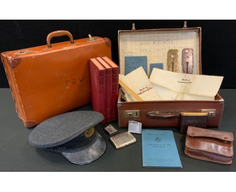 RAF peak cap;  brass button polishers;  lighters;  two suitcases;  Air Force Airman's service book;  other paperwork 
