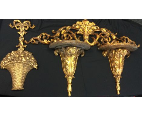 A carved gilt leafy bracket, 127cm long;  two gilt wall brackets;  etc (4) 
