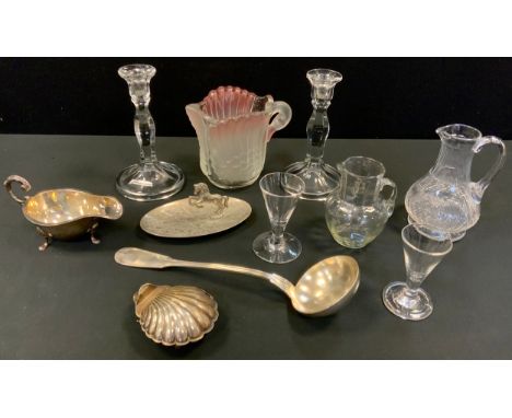 A Victorian clear glass jug;  a pair of clear glass candlesticks  a Victorian jug, slice and strawberry cut;  a plated sauce 