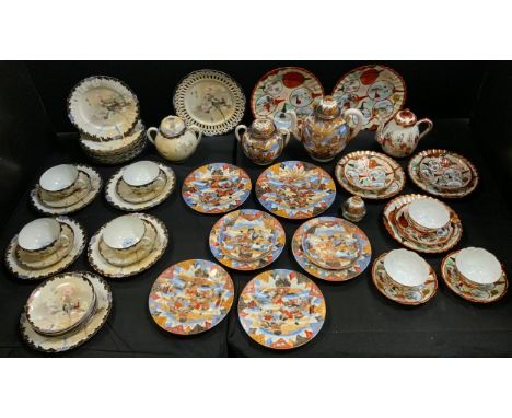A Japanese eggshell porcelain part tea service intricately decorated with traditional birds and foliage;  other part sets, Sa