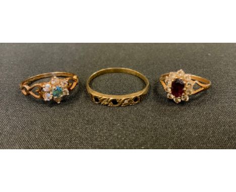 A 9ct gold diamond and ruby cluster ring, others diamond and sapphire line ring etc, all 9ct gold shanks, sizes X, N, I, 4.9g