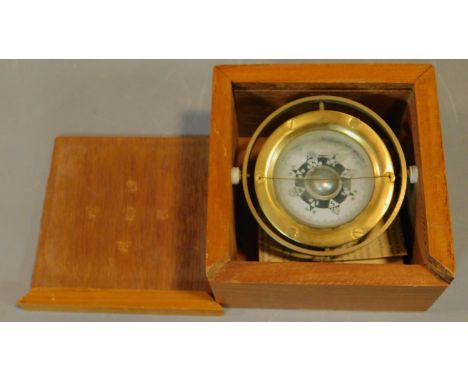 A boxed mariner's compass with Chinese astrological compass points. 13.cm x 13cm. 