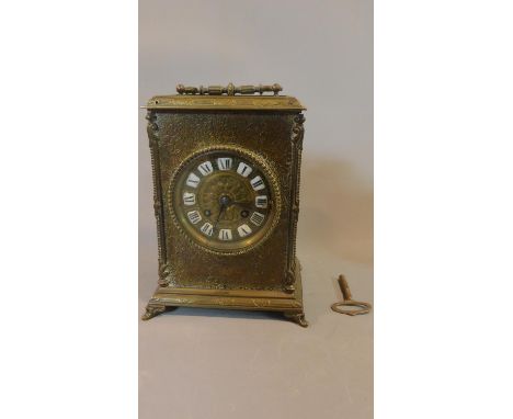A late 19th century brass cased mantel clock H.23 W.17cm (with key and pendulum) 