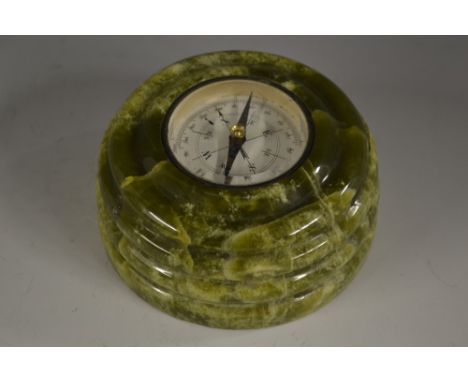 A green marble desk compass, blued steel indicator, ribbed border, 8.5cm diam 