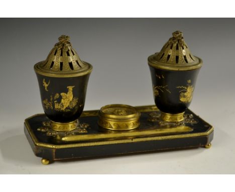 A 19th century Japanned inkwell, in the Louis XVI manner, each bell shaped well with pierced domed cover, canted rectangular 