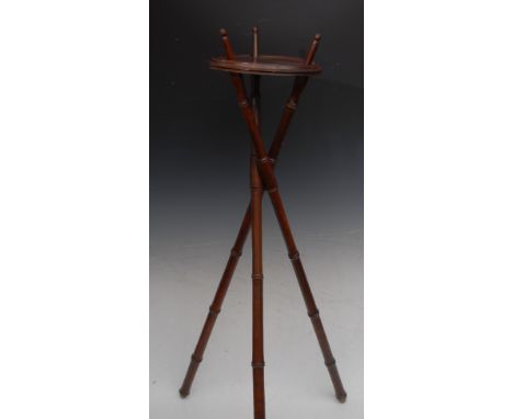 A late Victorian Campaign candle stand or torchere, removable circular top, folding faux bamboo tripod base, 106cm high, c.18