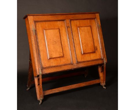 A Victorian country house easel-back folio cabinet, hinged top, fall front with a pair of raised and fielded panels enclosing