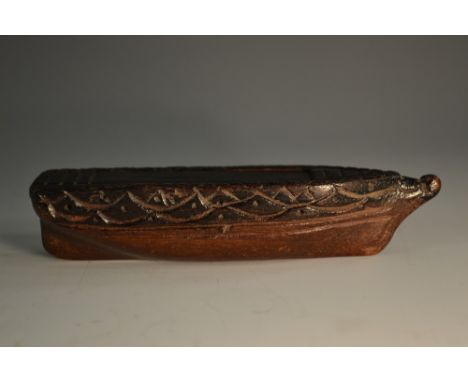 A 19th century mahogany novelty snuff box, as a boat, sliding cover, 12cm wide, c.1880