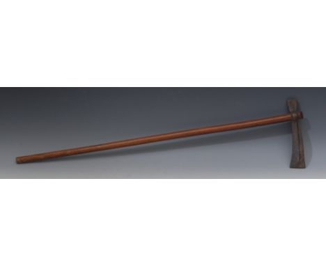Tribal Art - an African axe, the slightly through-socket head with central ridge, slender shaft with incise carved geometric 