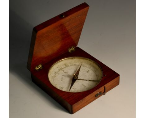 A late 19th century mahogany travelling pocket compass, hinged cover enclosing a 6cm dial, blued steel needle with locking me