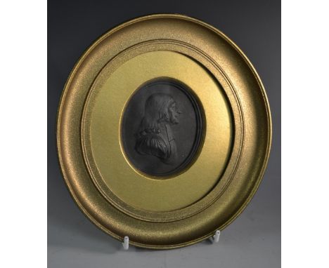 A 19th century Wedgwood black basalt oval portrait medallion, of John Wesley, the Methodist preacher and theologian, bust-len