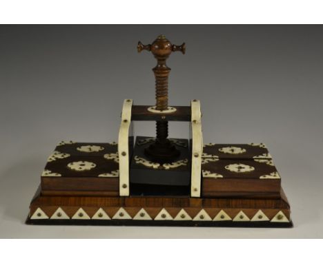 A 19th century ivory mounted rosewood playing waiter and press, screw mechanism to centre flanked by four rectangular card bo